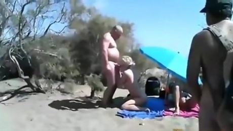 Cuckold threesome at a nude beach. spectators ? they don't give a