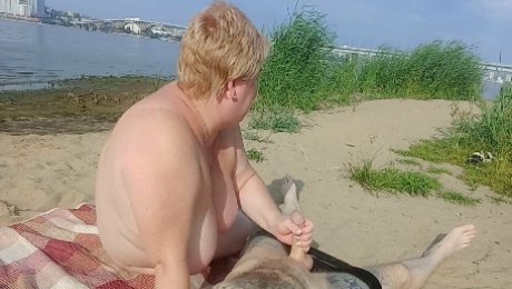 sucking cock and jerking off on a public beach