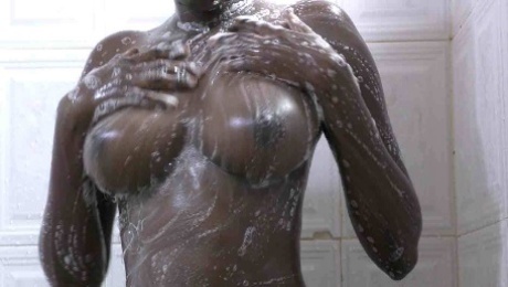 Natural ebony boops shaved pussy taking shower