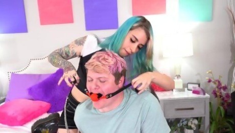 Blue haired Pearl Sage puts on a strap on toy to fuck a horny dude