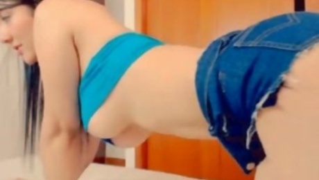 Impressive latina model pulls down her jeans shorts