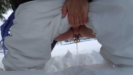 Nipple ring lover pissing outdoor in snow flashing huge pierced nipples and pierced pussy with stretched pussy lips