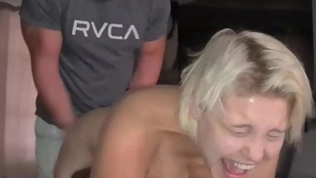 Spanking a pale skinned blonde's ass